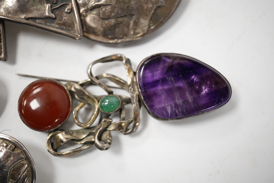 Elaine Coyne- A late 1980's modernist silver and cabochon garnet set drop brooch, 11.8cm, a pair of similar silver circular ear clips and a 1980's silver, carnelian, adventurine quartz and amethyst set brooch. Condition